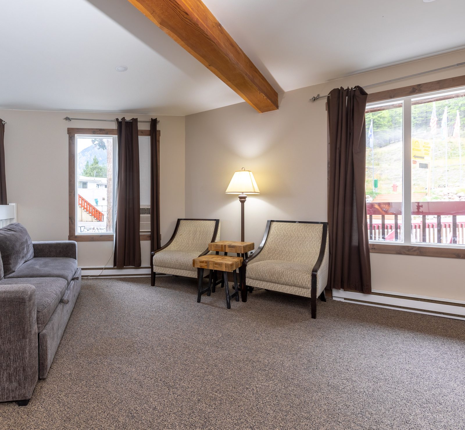 Corner Third Floor Suite lounge with mountain windows
