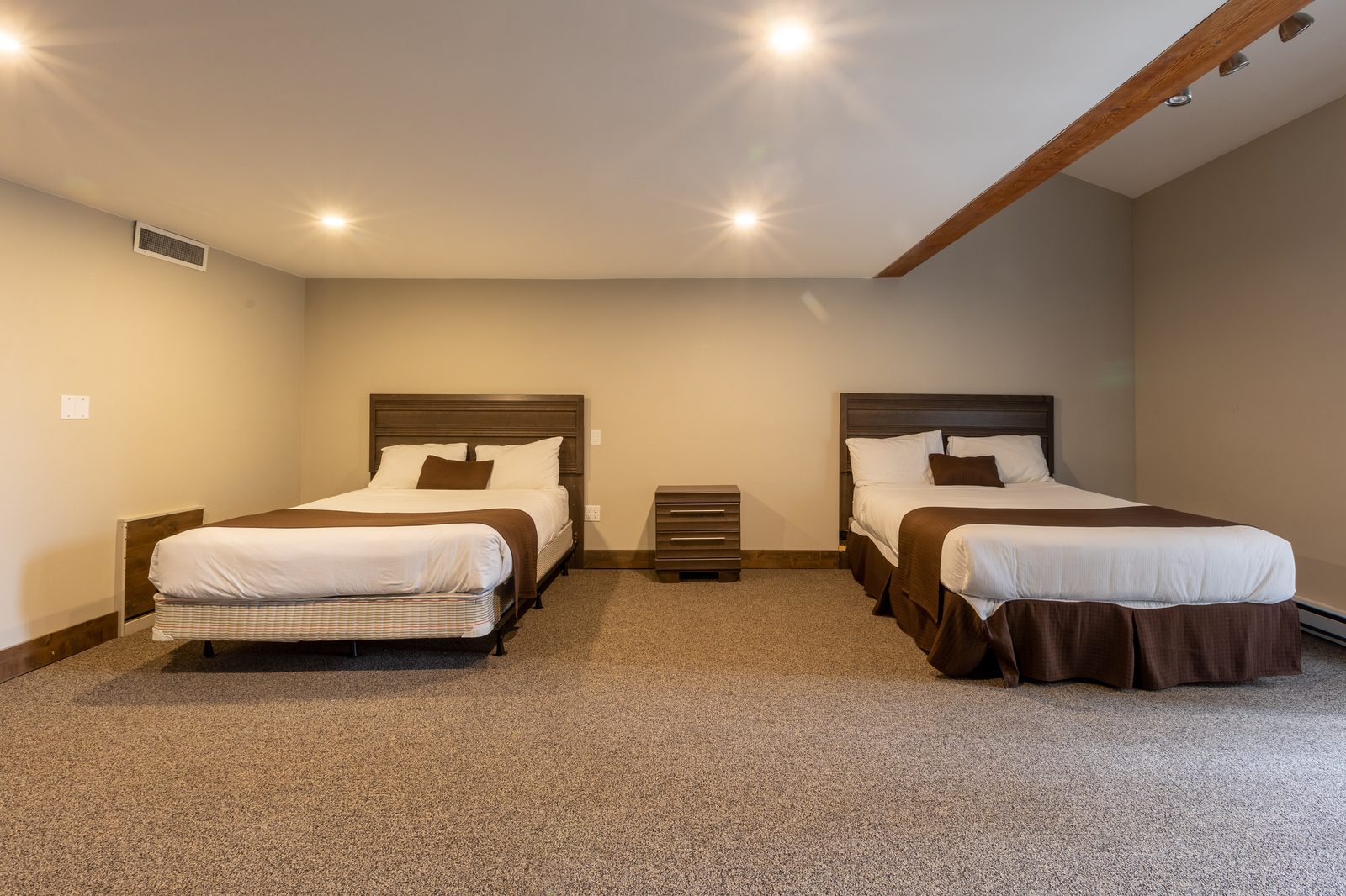 Deluxe Family Suite bedroom with two queen beds